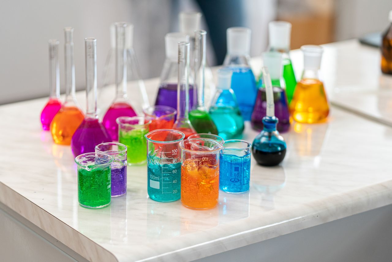 Crafting Captivating Headlines: Your awesome post title goes here Vibrant laboratory glassware with colored liquids for chemistry experiments.
